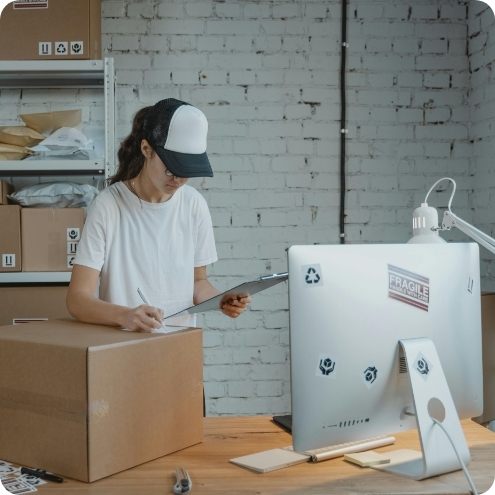 Women Packaging Goods for Her Small Business